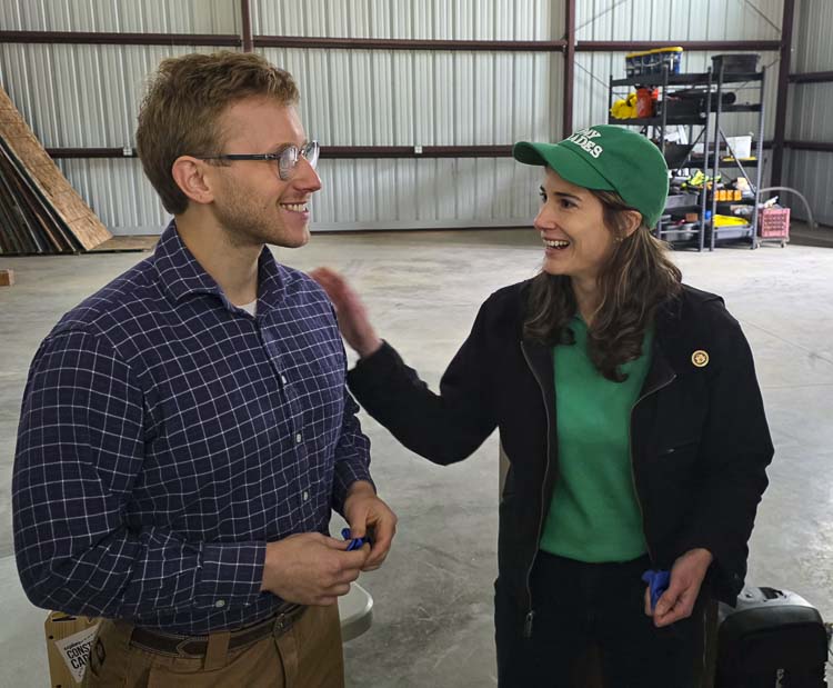 U.S. Representative Marie Gluesenkamp Perez chats with La Center teacher Jack Leedon, the career technical education instructor. The Congresswoman was in La Center to open a new trades center at the high school. Photo by Paul Valencia