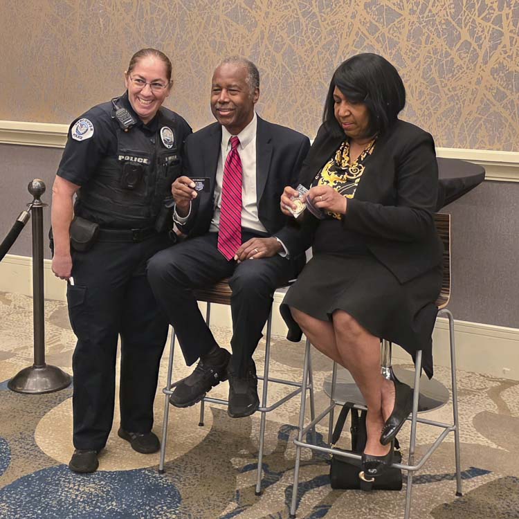 Dr. Ben Carson and Candy Carson, who have been married for 50 years, were in Vancouver on Thursday at a fundraiser for Pathways Clinic. Before the event, the Carsons met with several VIPs, including Holly Musser of the Vancouver Police Department. She presented the Carsons with Kindness 911 merchandise. Photo by Paul Valencia