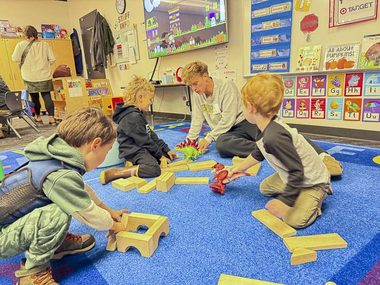 RHS students help guide fun, hands-on activities designed to support growth and learning for Ridgefield’s youngest Spuds. Photo courtesy Ridgefield School District