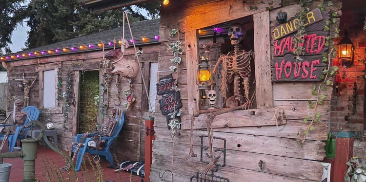 Joseph the Caretaker, with lantern in hand, welcomes guests to the Silver Star Cemetery. Photo by Paul Valencia