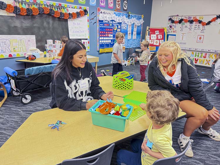 High Schoolers from Ridgefield’s Child Development program work side-by-side with preschoolers, gaining valuable experience and sharing plenty of smiles along the way. Photo courtesy Ridgefield School District