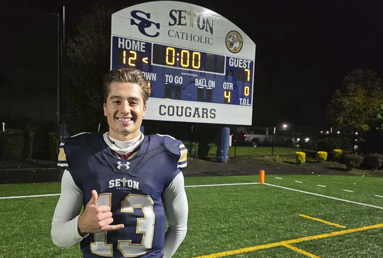 Kolten Gesser is all smiles after Seton Catholic beat La Center 12-7 on Friday to claim the Trico League football title. Gesser has been a key leader for the Cougars this season. Photo by Paul Valencia
