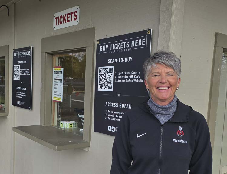 Marcia Johnson’s day job is working with Camas Athletics in the high school. But she is also in the ticket booth for big events at Doc Harris Stadium. Photo by Paul Valencia