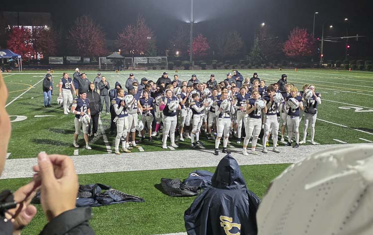 The Seton Catholic football players thank their fans for supporting them Friday night in the Cougars’ win over La Center for the Trico League title. Photo by Paul Valencia
