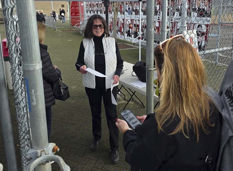 Mary Taylor greets every visitor who walks through her gate with a smile at Doc Harris Stadium. Photo by Paul Valencia