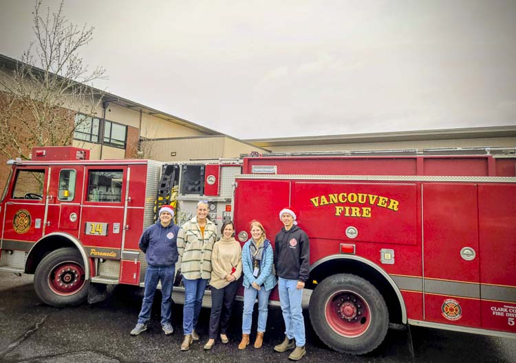 Vancouver Firefighters Christian Vazquez and Zachary Day at Endeavour Elementary with staff. Photo courtesy Vancouver Fire Department