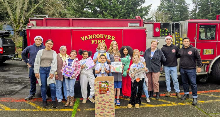 Vancouver Firefighters Christian Vazquez and Zachary Day at Riverview Elementary with staff and Student Council. Photo courtesy Vancouver Fire Department