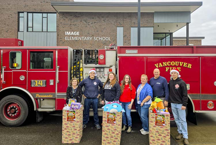 Vancouver firefighters Christian Vazquez, Zachary Day and Bill Dunlap at Image Elementary. Photo courtesy Vancouver Fire Department