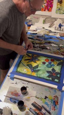 Matthew Clarkson working in alcohol inks on board. Photo courtesy RedDoor Gallery