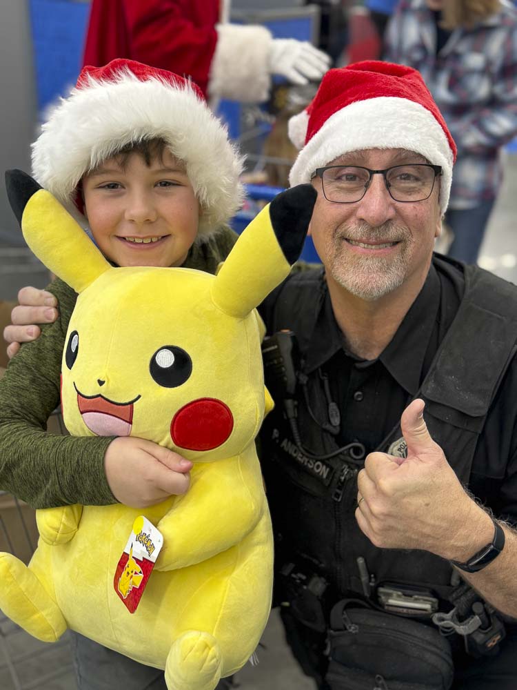 Officer Anderson and boy shopper. Photo courtesy city of Battle Ground