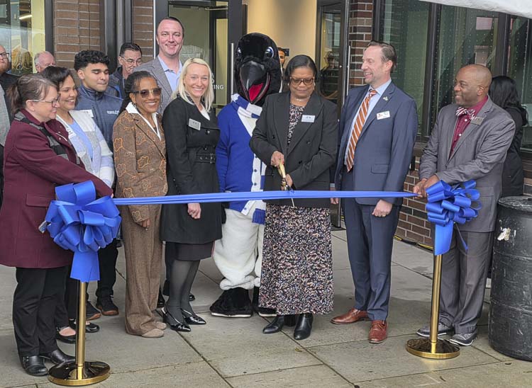 Dr. Karin Edwards of Clark College and others gather to cut the ribbon for the Clark College Advanced Manufacturing Center at Boschma Farms in Ridgefield on Thursday. Photo by Paul Valencia