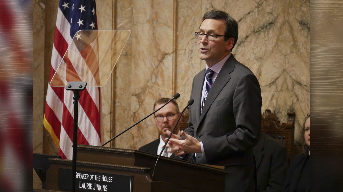 Gov. Bob Ferguson’s State of the State address emphasized flood recovery, taxes on millionaires, and immigration enforcement while avoiding direct discussion of the state’s looming budget shortfall.