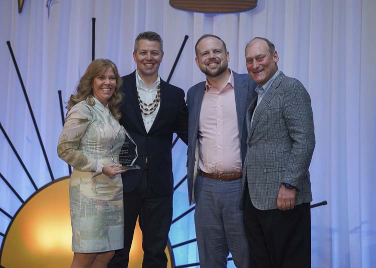 2025 Philanthropists of the Year, Kate Jones (left) and Marty Rifkin (right), stand with Community Foundation president Matt Morton (center left) and nominator Billy Henry. The couple was recognized for their decades-long support of education and basic human needs causes in southwest Washington, characterized by close partnerships and collaboration with the organizations they fund. Photo courtesy Community Foundation for Southwest Washington