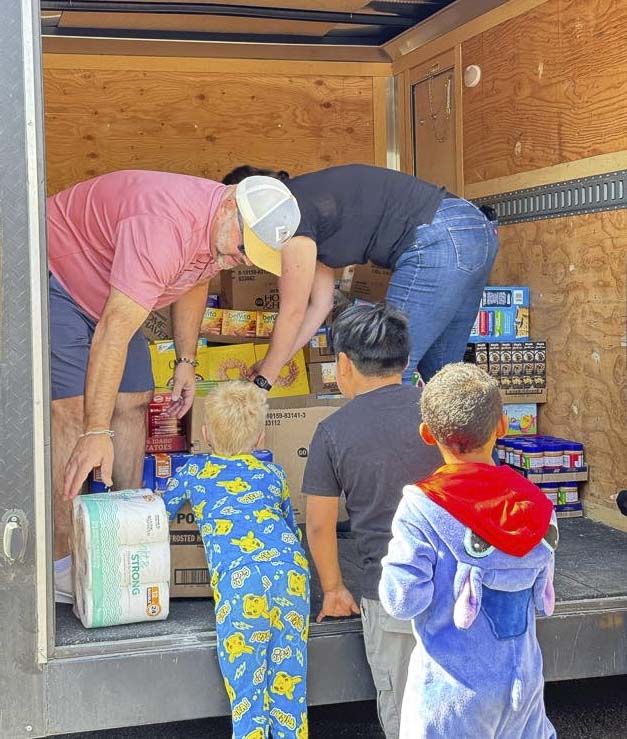 Windermere Northwest Living brokers hosted a food drive last year for Fruit Valley Elementary School families. Photo courtesy Winderemere Real Estate Vancouver