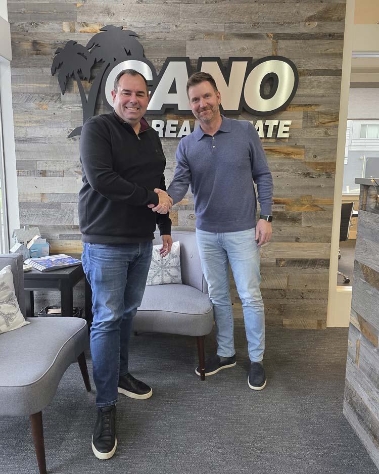 Nathan Cano (left), owner and designated broker of Cano Real Estate, welcomes Kelly Winn (right) back to the team. Photo courtesy Cano Real Estate