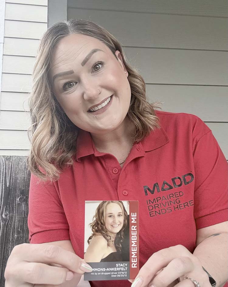 Ashley Bonus of Mothers Against Drunk Driving holds up a picture of her sister Stacy Gammons-Ankerfelt, who was killed in 2012. MADD is lobbying to lower the legal limit for BAC to 0.05 in the state of Washington. Photo courtesy Ashley Bonus