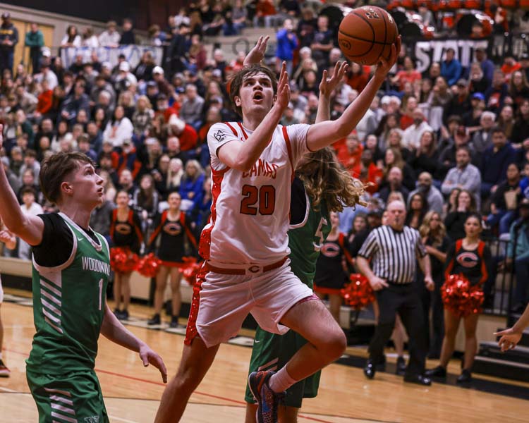 Camas’ Mason Hamilton drives to the hoop for two points during Camas’ playoff game against Woodinville on Friday night. Photo courtesy Chris Barker