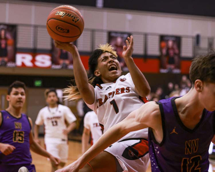 Fort Vancouver’s Brino Masamy goes up for a challenging shot in Friday’s playoff game against Nooksack Valley. Photo courtesy Chris Barker