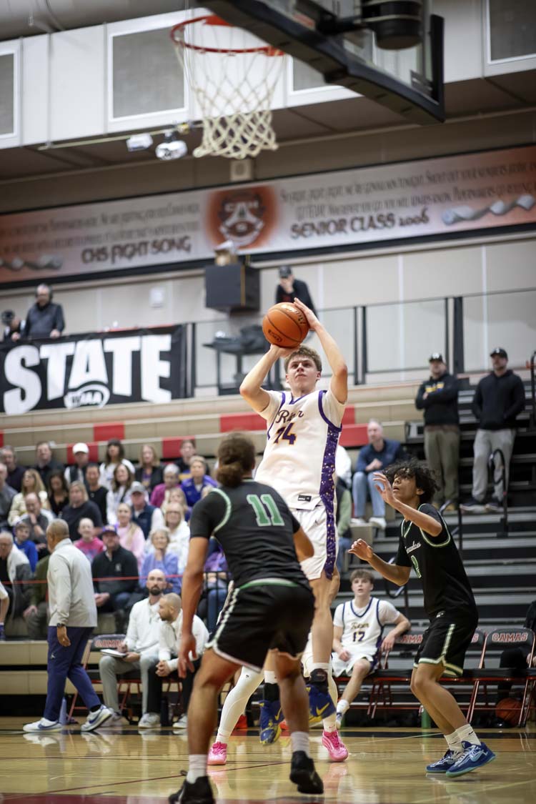 Josh Paxton, shown here Saturday in the state opening round, hit a big 3-pointer in overtime on Wednesday in Yakima to help Columbia River advance to the quarterfinals in the Class 2A state boys basketball tournament. Photo courtesy Heather Tianen