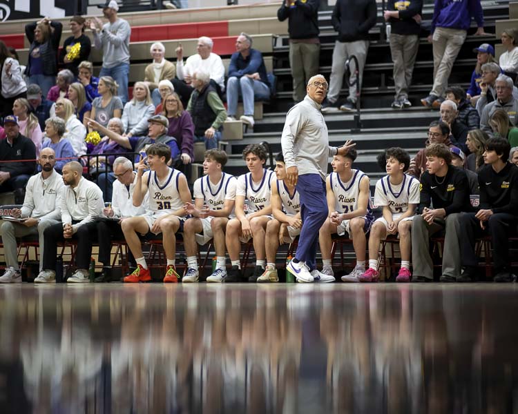 Columbia River boys basketball and coach Mark Ganter, shown here last weekend at the state’s opening round game, will be playing Friday night in the Class 2A boys basketball state semifinals. Photo courtesy Heather Tianen