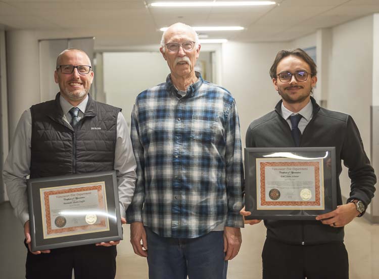 Paramedic Shawn Zupfer and Emergency Medical Technician Aidan Schrater received a Certificate of Appreciation for reviving a cardiac arrest patient (pictured center) while working alone in back of an ambulance. Photo courtesy Vancouver Fire Department
