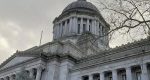 Washington lawmakers narrowly approved a new income tax on households earning over $1 million, setting the stage for court battles and a statewide initiative campaign.