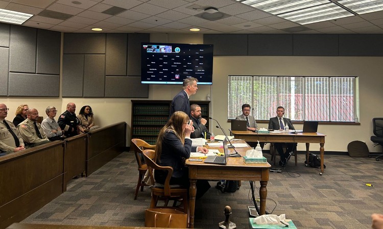 Mark Lamb, the attorney for four eastern Washington sheriffs, speaks in Thurston County Superior Court against a new law setting heightened eligibility standards for sheriffs as several county sheriffs observe on Wednesday (April 29).