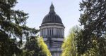 Washington’s latest $79.4 billion state budget taps rainy day funds, reduces child care provider payments, and defers big tax collections, setting up a deficit in 2028.