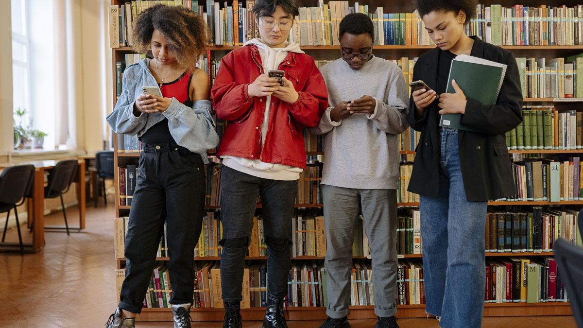 At Robert Eagle Staff Middle School, all-day phone removal led to fewer conflicts and more student engagement, but some parents and lawmakers argue a ban should not be imposed statewide.