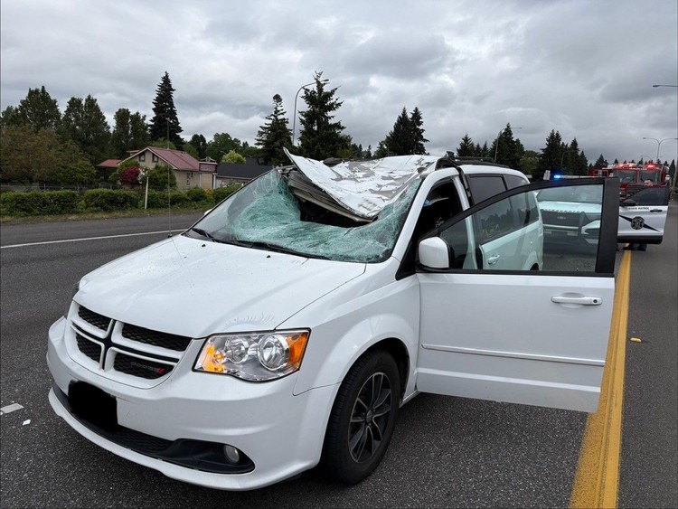 A detached semi-truck tire struck a southbound minivan on I-5, sending the driver to a local hospital with moderate injuries.
