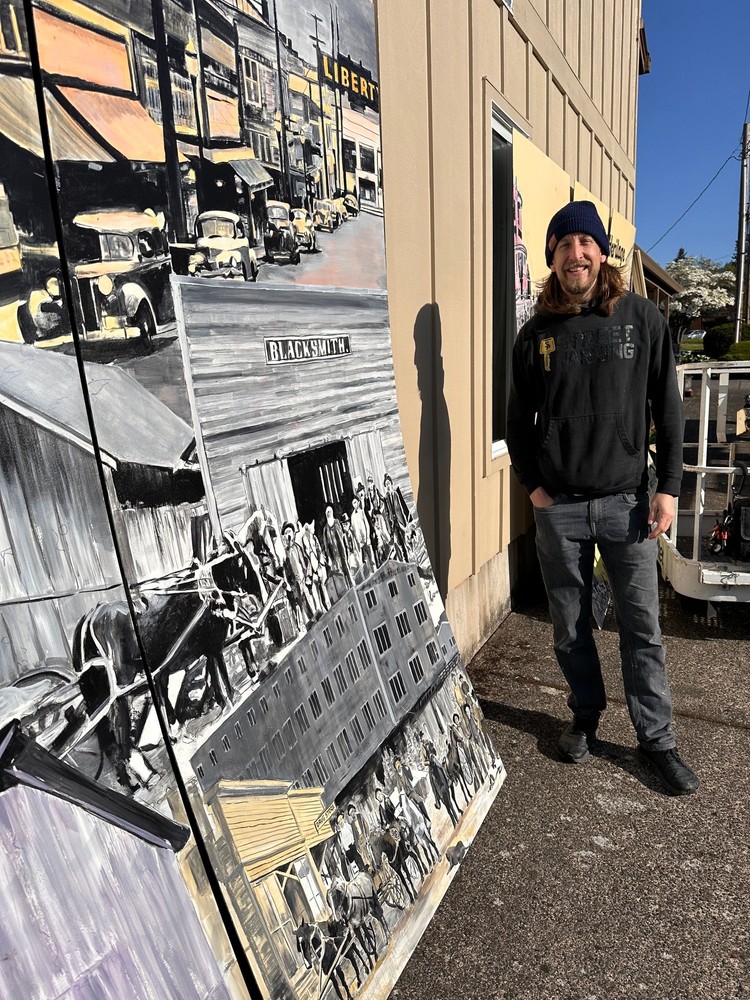 A 24x8-foot mural by Travis London captures early Camas and Washougal life on a museum carriage house wall.
