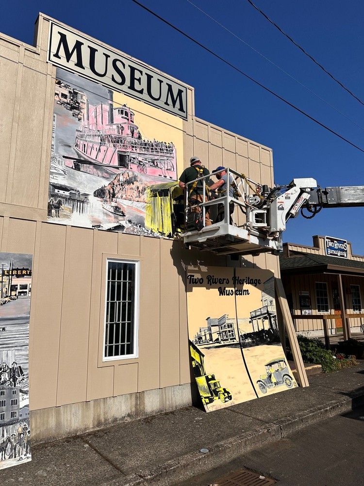 A 24x8-foot mural by Travis London captures early Camas and Washougal life on a museum carriage house wall.