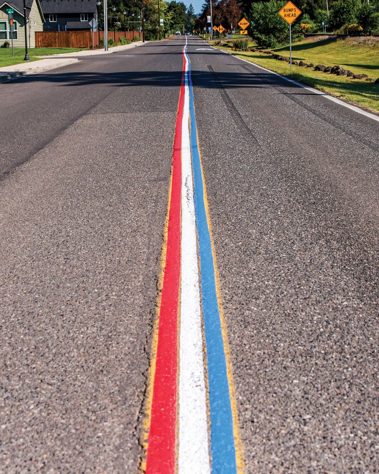 Railroad Avenue in Yacolt is adorned with red, white and blue road striping on Friday, May 22. But a complaint to the town may cause the centerline striping to be painted over with standard yellow.
