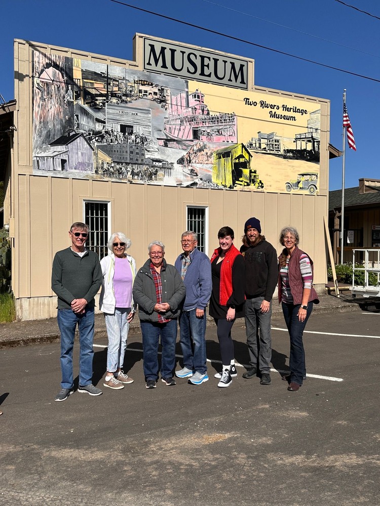 A 24x8-foot mural by Travis London captures early Camas and Washougal life on a museum carriage house wall.