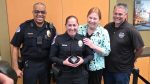 Vancouver Police Chief Troy Price, left, officer Holly Musser, Vancouver Mayor Anne McEnerny-Ogle, and Kindness 911 founder Jason Hattrick are all smiles after Musser was awarded the Kindness Cop of the Year award Monday at City Hall. Photo by Paul Valencia