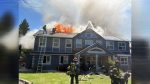 A non-ambulatory man was carried to safety after fire spread into the attic of a Clark County adult family home.
