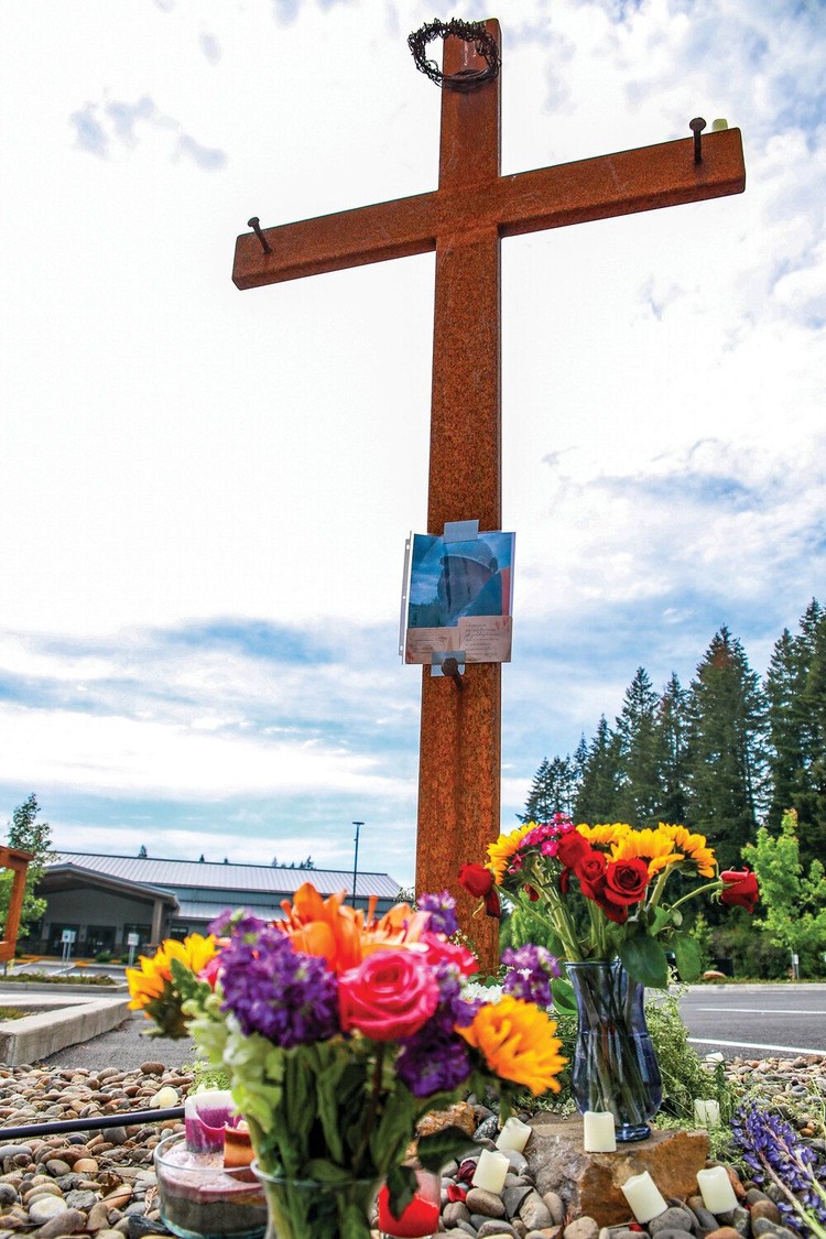 Pastor Bill Douglas of Yacolt Community Church is remembered by a cross located along Amboy Road on church property service on Thursday, May 28. Douglas died from injuries sustained in a motorcycle crash near Yacolt on Wednesday, May 27.