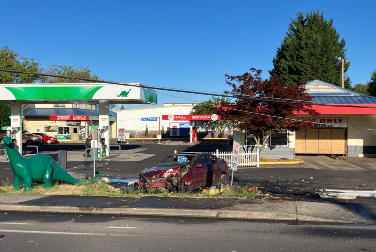A 44-year-old driver was hospitalized after his Mazda 3 struck a power pole and caught fire on NE Highway 99.