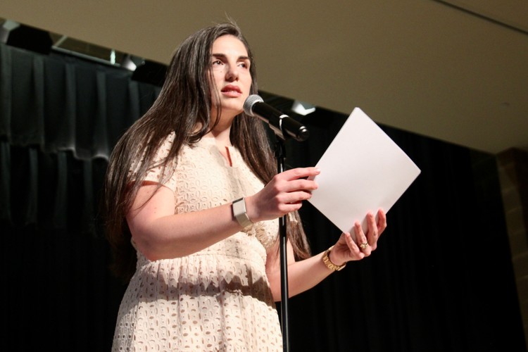 Director of Bands Alison Pierce delivers remarks before student performances begin at the annual spring concert.