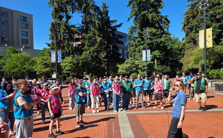 Volunteers listen to a pep talk Friday morning before heading off into downtown Vancouver to pick up trash as part of the Pick It Up, Vancouver event, courtesy of SOLVE.