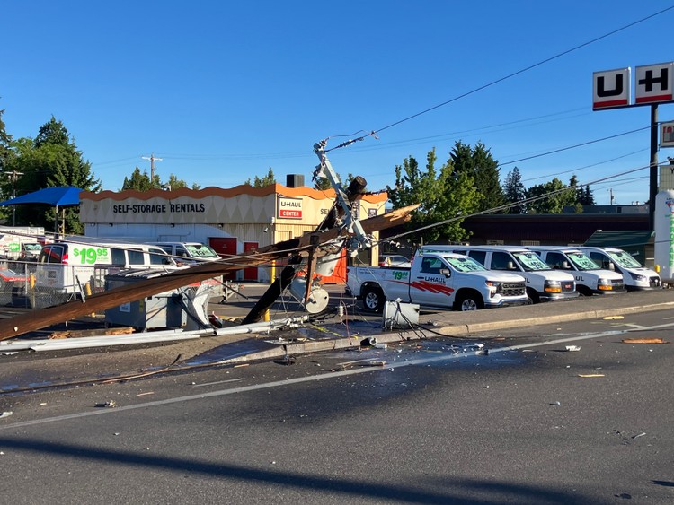 A 44-year-old driver was hospitalized after his Mazda 3 struck a power pole and caught fire on NE Highway 99.