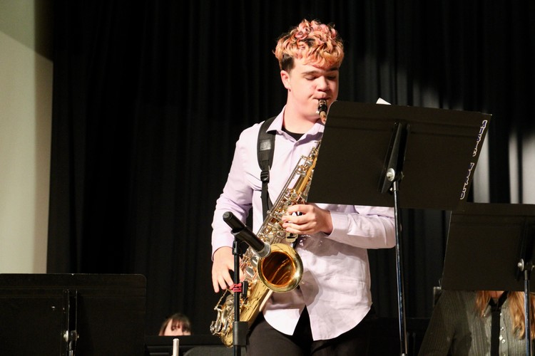 Jaxson Glover performs a tenor saxophone solo during the Jazz Band’s performance of “Cold Duck Time.”