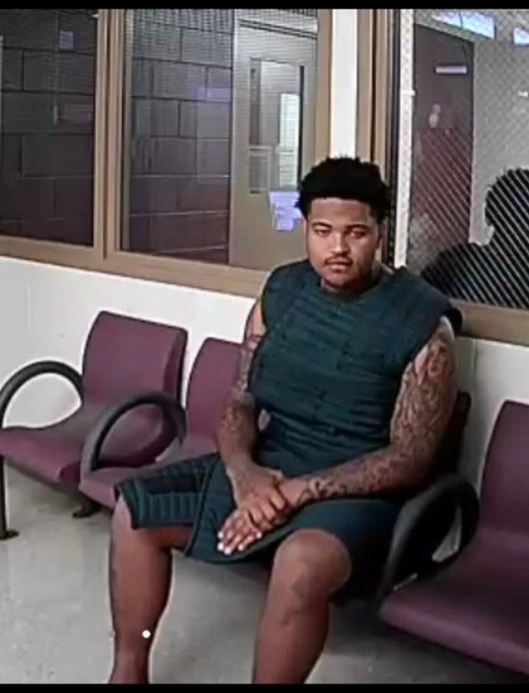 James Gill III, 18, of Battle Ground, makes his first appearance in Clark County Superior Court on Monday, Aug. 17, wearing a suicide prevention smock.