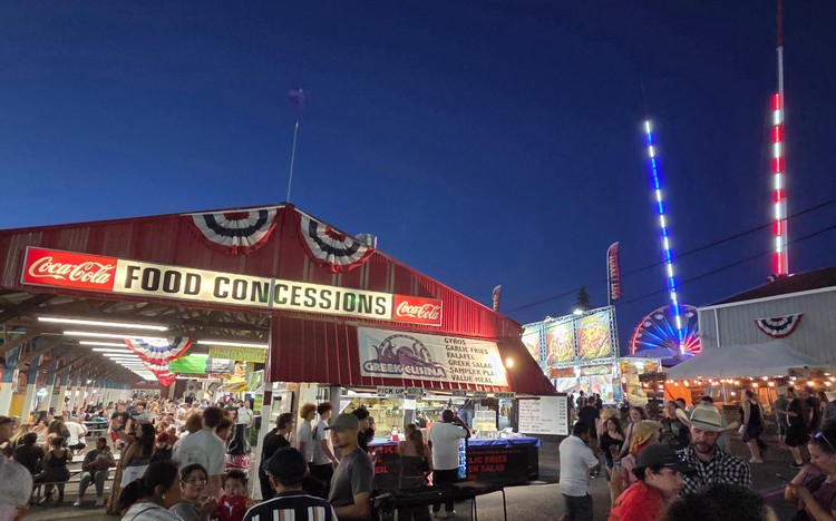 Paul Valencia captures the Clark County Fair's nighttime energy, where carnival rides blaze with color until 11 p.m. on Fridays and Saturdays.