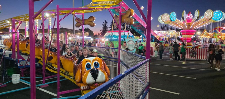 Paul Valencia captures the Clark County Fair's nighttime energy, where carnival rides blaze with color until 11 p.m. on Fridays and Saturdays.