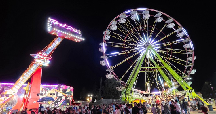 Paul Valencia captures the Clark County Fair's nighttime energy, where carnival rides blaze with color until 11 p.m. on Fridays and Saturdays.